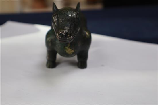A Chinese gold and silver inlaid bronze figure of a tapir, Han dynasty or later, L. 12cm, excluding hardwood stand and fitted box